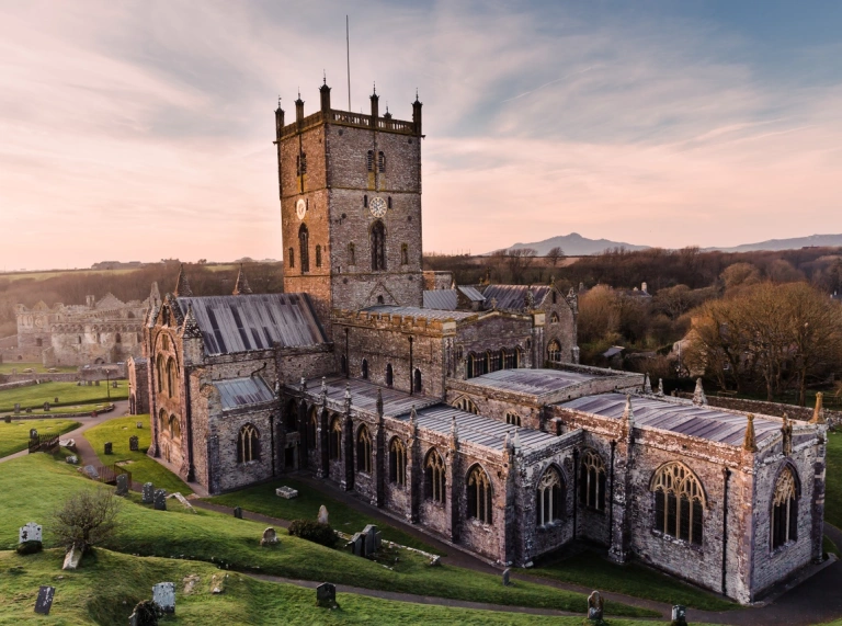 A magnificent view of the entire St Davids Cathedral during sunset.