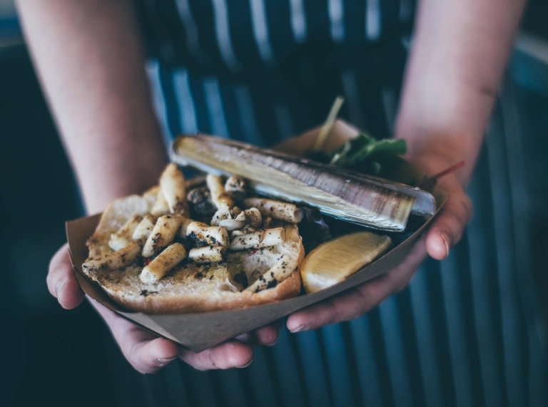 A plate of seafood being served.