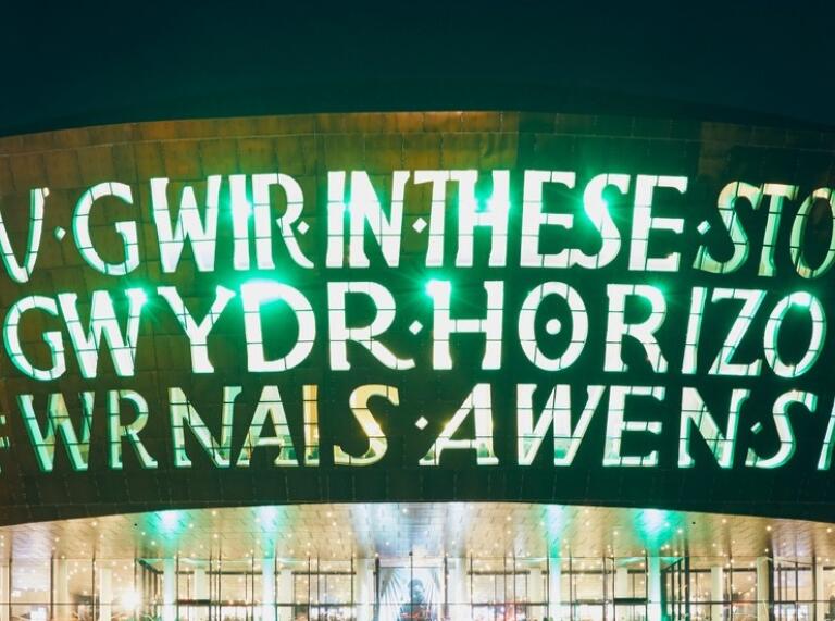 Inscription lit up outside the Wales Millennium Centre