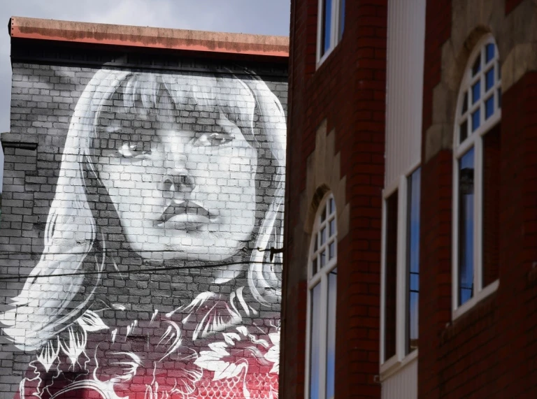 image of a woman drawn onto the side of a building in Womanby Street Cardiff