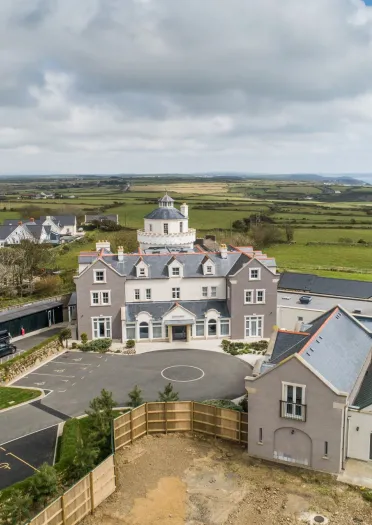 An aerial shot of Twr y Felin Hotel with the Pembrokeshire coast in the background.