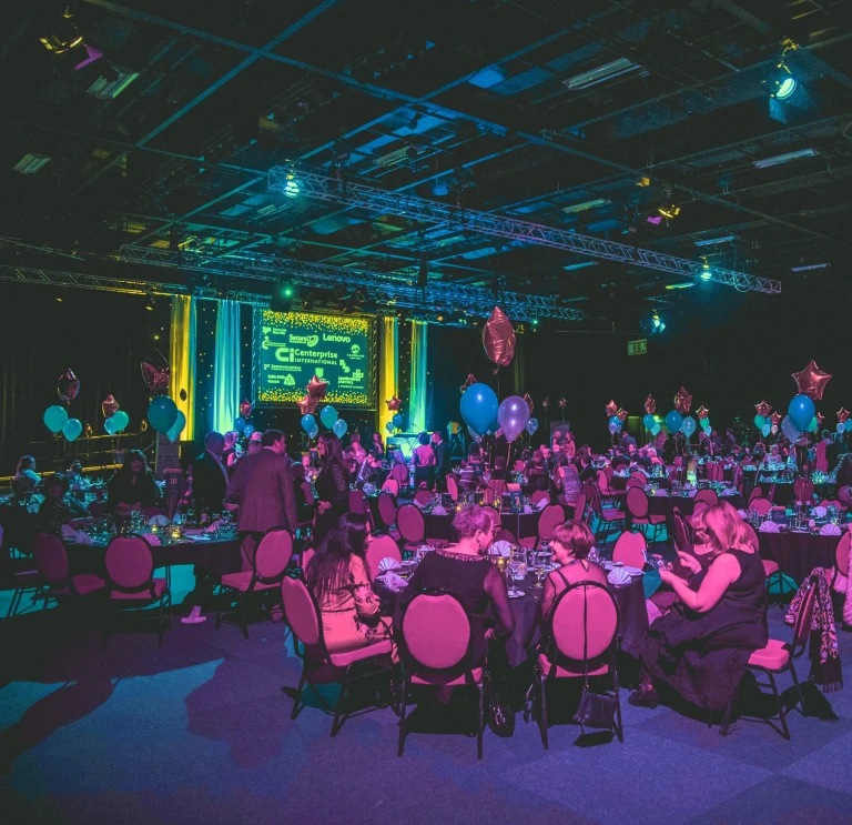 People enjoying a gala dinner evening inside the Venue Cymru.