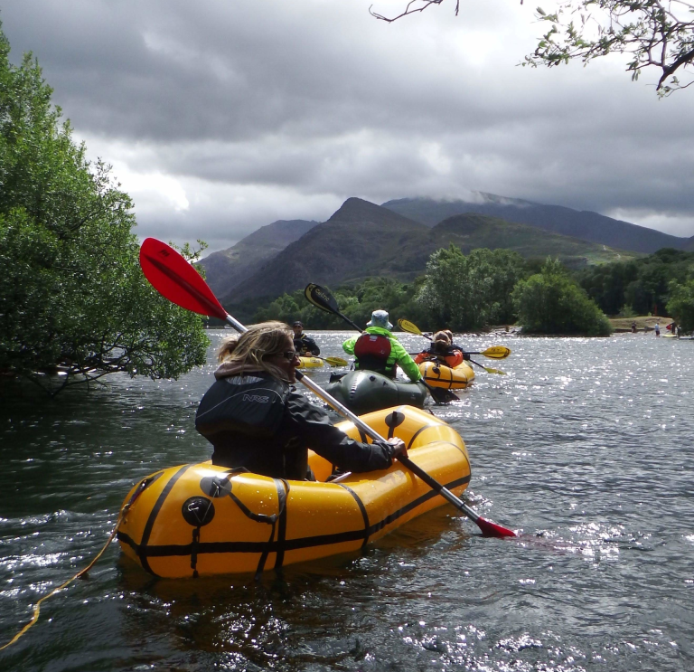 People pack rafting with Adventure Tours UK.