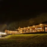 Outside the buildings of Fforest accommodation at night.